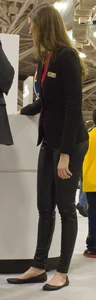Pretty car saleswoman in tight shiny black pants with nice ass