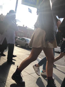Nice legs, candid girl wearing a skirt and boots