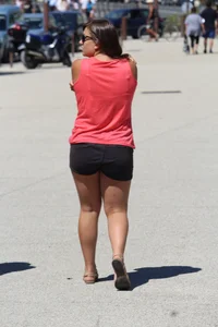 Thick girl in pink top and black shorts with vpl