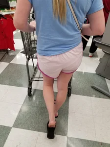 Nice blonde ass in athletic shorts while shopping