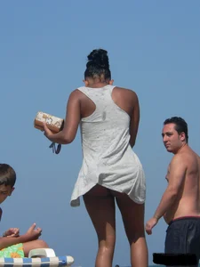 Hot ass topless beach girl with great tits lets her little brother oil up her ass in thong bikini
