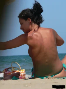 Bunch of sexy babes on the beach topless and in thong bikinis