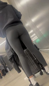 Tight curvy latina at airport pulls up pants