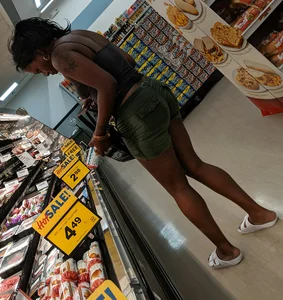 Ebony chick grocery shopping in green shorts