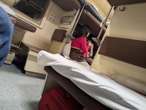 Sleeper train candid girl wearing brown pants bending over