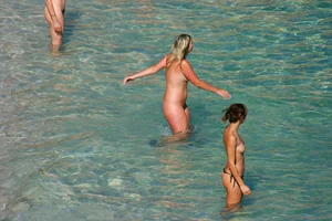 FKK Nudists playing in the water with floater
