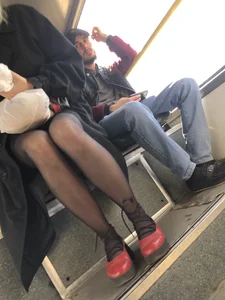 Amazing legs in black pantyhose in a public bus