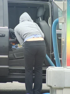 Girls cleaning their cars in jeans and pants
