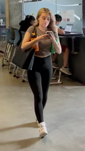 Blonde College Girl In Leggings Girl Keeps Touching Her Booty