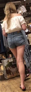 Blonde in jean shorts at the barrel or crackers