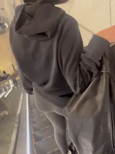 Tight curvy latina at airport pulls up pants