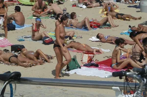 Topless girls on a beach in Barcelona