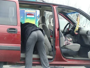 Girls cleaning their cars in jeans and pants