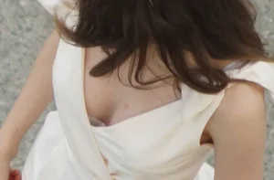 Downblouse closeup of a hot candid girl passing by on the street