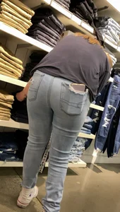 Two blonde teens shopping
