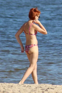 Couple of hot babes hanging out at the beach in bikinis