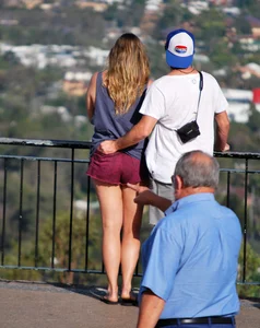 Girl in short maroon shorts with decent booty
