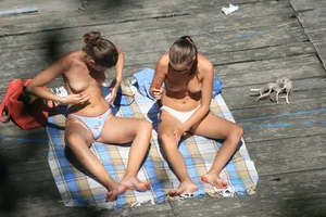 Two teens stripping and going topless to tan