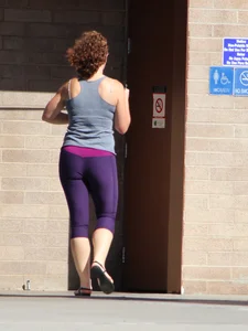 Milf with a nice ass in tight purple leggings