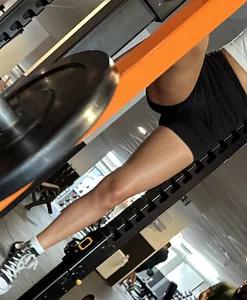 Hot tanned girl in gym with amazing legs and tight ass