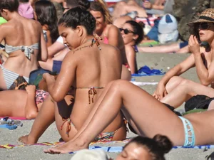 Pretty brunette in a bikini at the beach
