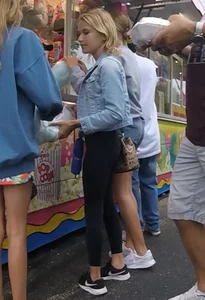Cute blonde carnival girl in leggings
