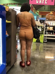 Latina with hard nipples and a big booty in tight spandex shorts outfit