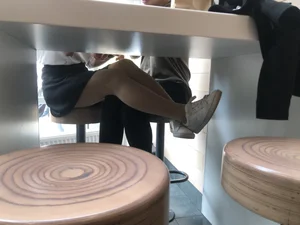 Girl in a Skirt and Pantyhose Touching Herself Under a Table at a Restaurant Creepshots Collection