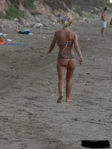 Tattooed blonde with big tits topless and in thong