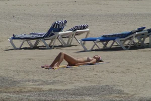 Girls on a nude beach in Sitges, Spain