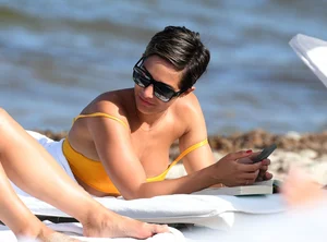 Frankie Bridge nip slips in a bikini on the beach