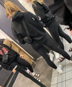 Tight ass sports team in line at airport