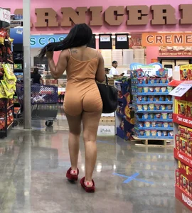 Latina with hard nipples and a big booty in tight spandex shorts outfit