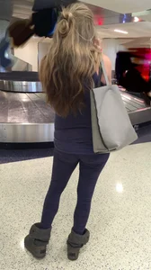 Pregnant blonde girl in leggings at the airport