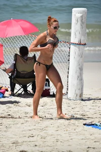 Redhead with nice tits in a bikini on the beach