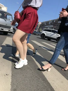 Girl in a Skirt with Sexy Skinny Legs on the Crosswalk Candid Photos
