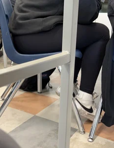 College teen in leggings sitting at her desk in class creepshots