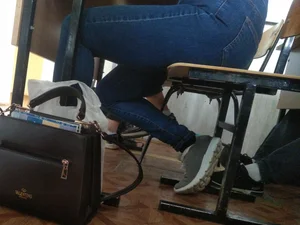 Candid Legs in Tight Jeans Under Desk in Classroom