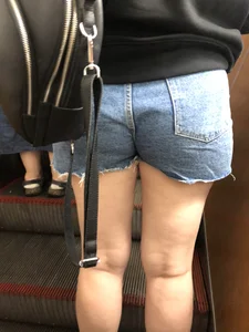 Hot Booty In Blue Jean Shorts And Chunky Legs Creepshots Gallery on a Subway Escalator