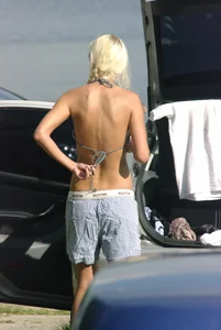 Blonde babe changing into and out of bikini and shows her tits