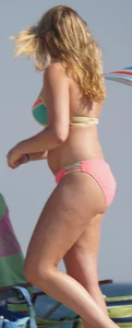 Thick blonde bikini babe on the beach