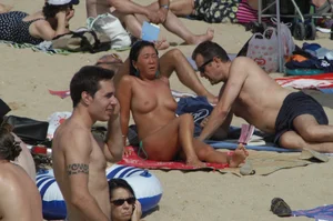 Topless girls on a beach in Barcelona