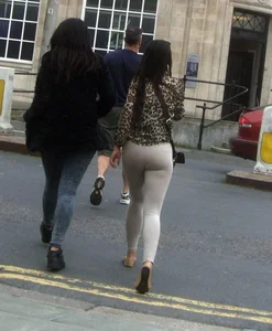 Brunette lady with a nice ass in light grey leggings walking