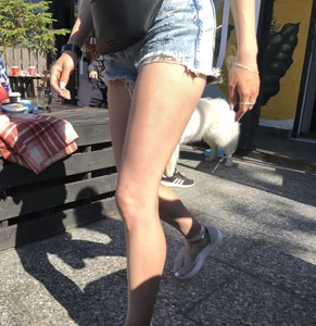 Girl in Denim Shorts with Amazing Hot Legs Fixing Her Sandals Street Candid Photo Gallery
