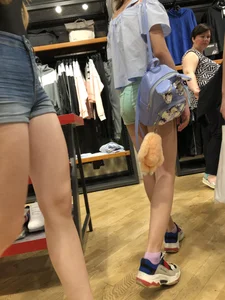 Girl with Amazing Hot Legs in Denim Shorts in a Store Candid