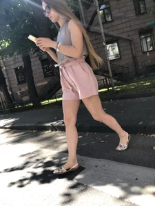 Cute candid girl in pink shorts street photos
