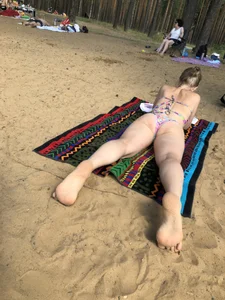 Series of Photos of Sexy Girls in Swimsuits Lying on a Beach With Slightly Spread Legs