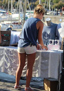 Sexy blonde girl in short white shorts