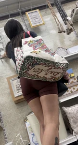 Cute girl in maroon shorts