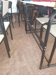 Crossed College Girl’s Legs in Black Pantyhose Under a Desk Classroom Creepshot